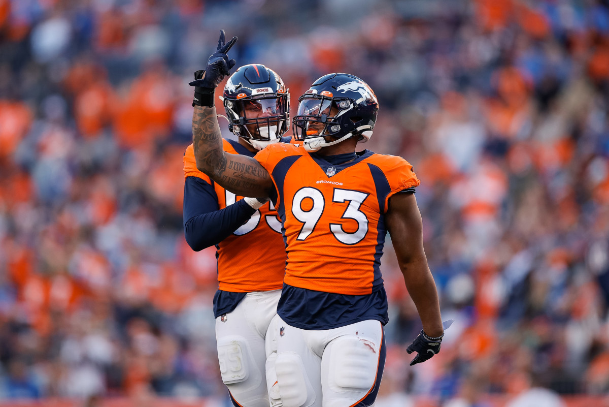 Dec 12, 2021; Denver, Colorado, USA; Denver Broncos defensive end Dre'Mont Jones (93) celebrates with linebacker Bradley Chubb (55) after a play in the third quarter against the Detroit Lions at Empower Field at Mile High. Mandatory Credit: Isaiah J. Downing-USA TODAY Sports