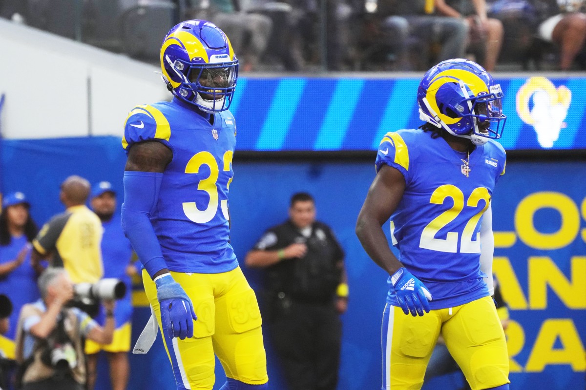 Oct 16, 2022; Inglewood, California, USA; Los Angeles Rams safety Nick Scott (33) celebrates with cornerback David Long Jr. (22) after intercepting a pass in the fourth quarter against the Carolina Panthers at SoFi Stadium. Mandatory Credit: Kirby Lee-USA TODAY Sports