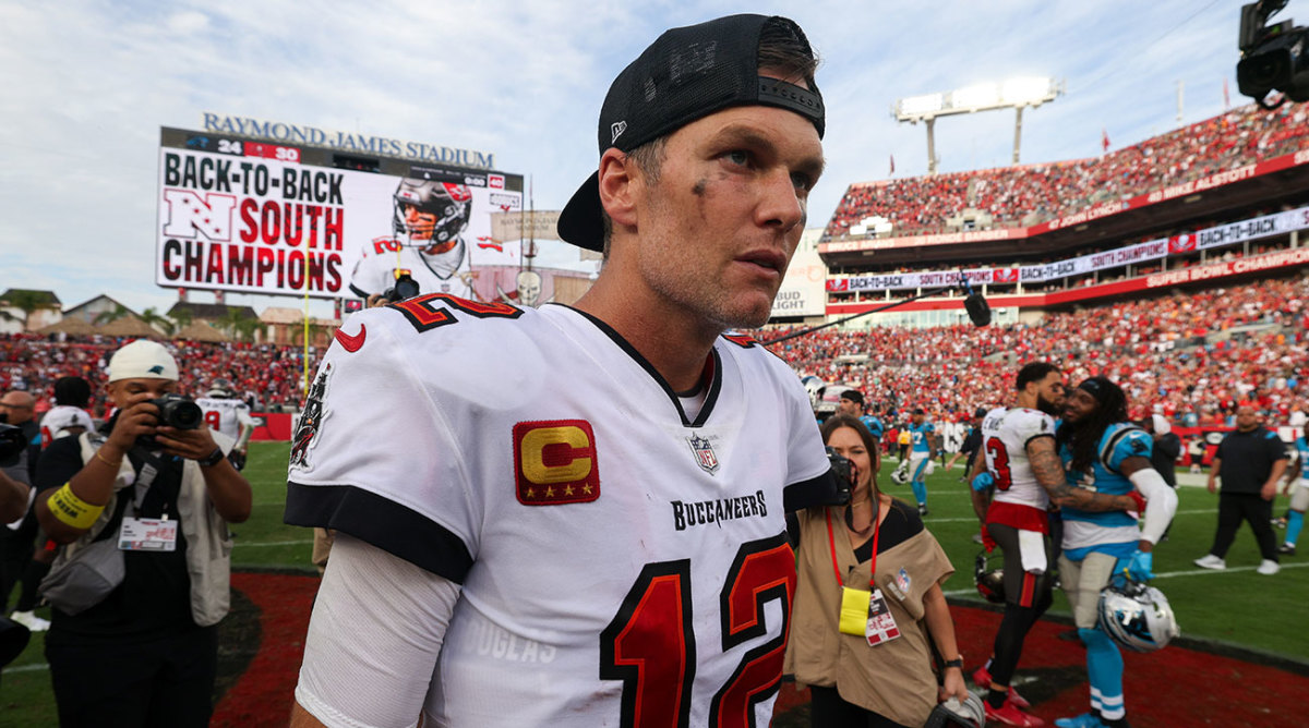 Tom Brady walks off the field after the Buccaneers clinch the NFC South title.