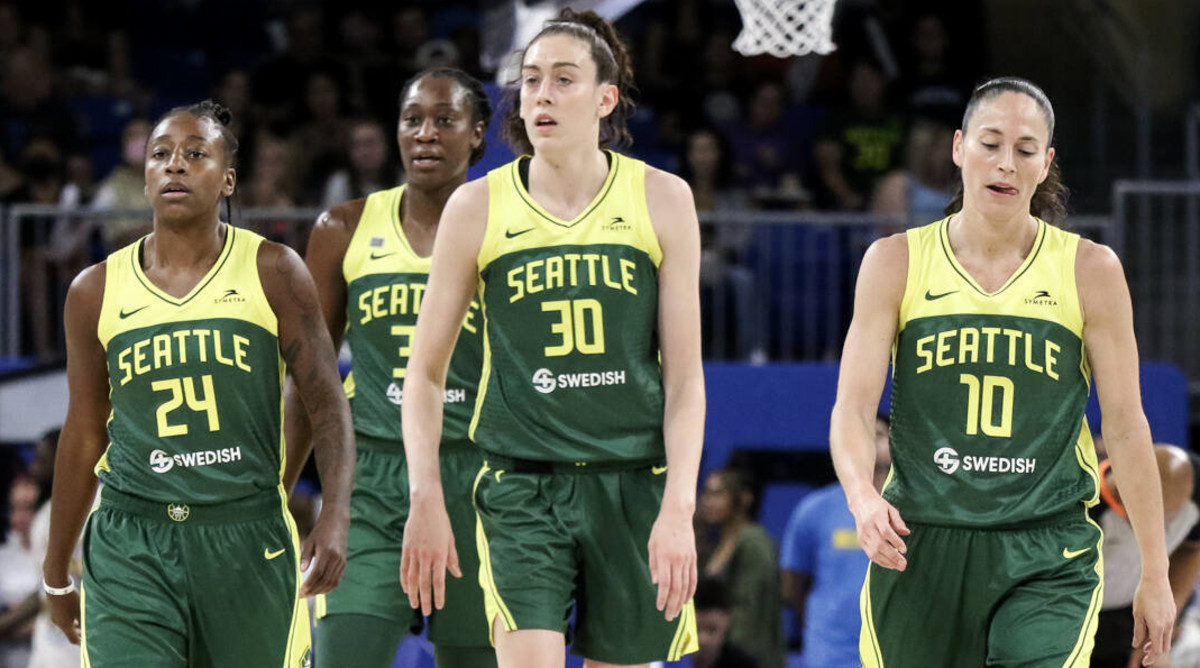 Jewell Loyd, Breanna Stewart and Sue Bird walk back to the bench during the Storm’s game against the Sky.