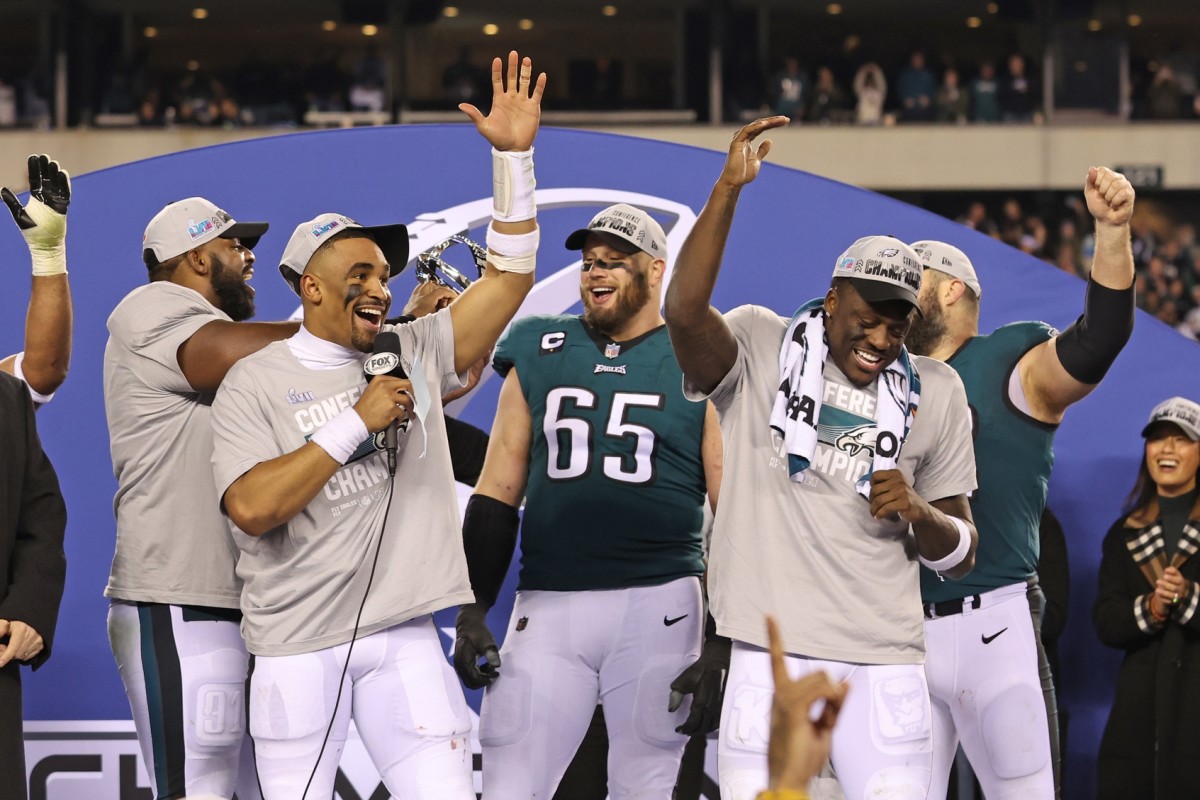 Eagles quarterback Jalen Hurts celebrates with teammates after Philadelphia beat the 49ers in the NFC championship.