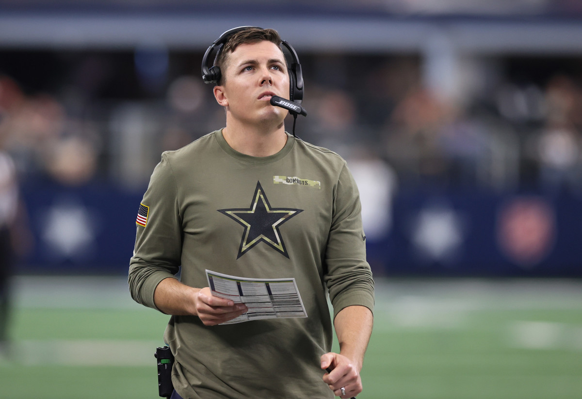 Nov 7, 2021; Arlington, Texas, USA; Dallas Cowboys offensive coordinator Kellen Moore on the sidelines in the second half against the Denver Broncos at AT&T Stadium. Mandatory Credit: Matthew Emmons-USA TODAY Sports