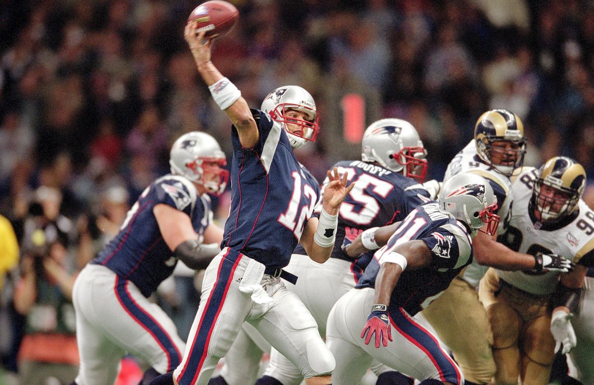 Tom Brady throws a pass against the Rams in his first Super Bowl