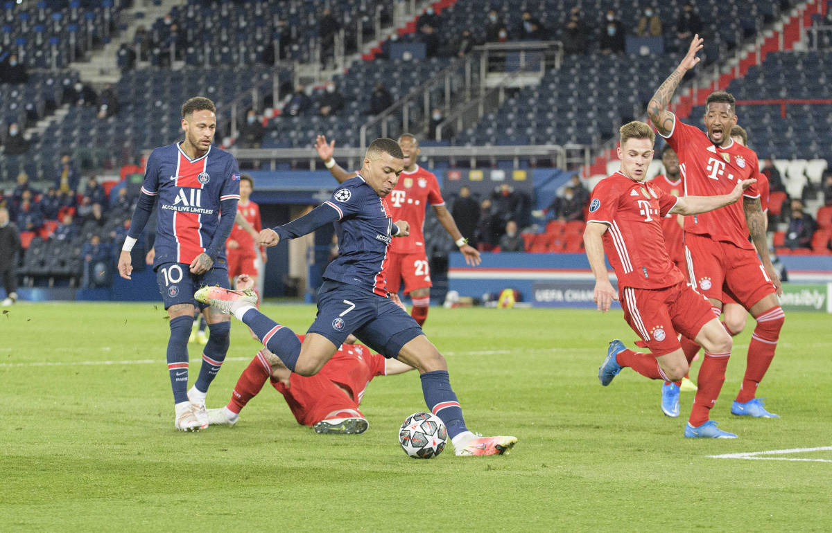 Kylian Mbappe pictured (center) in action for PSG against Bayern Munich in April 2021