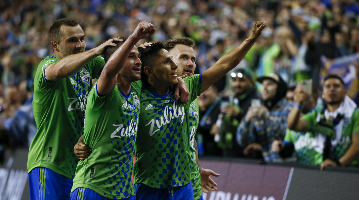 Sounders players celebrate winning the Concacaf Champions League.