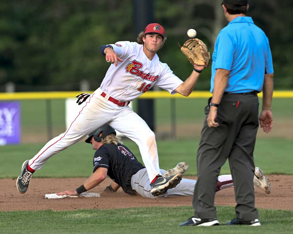 Alex Mooney of Falmouth arrives safely stealing second base as Bourne shortstop John Peck catches a throw. (2022)