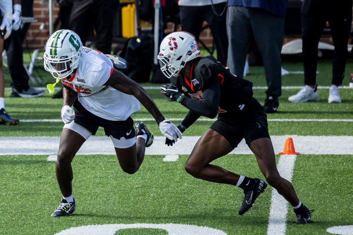National wide receiver Grant DuBose of UNC-Charlotte (15) practices with National defensive back Kyu Blu Kelly of Stanford (17) during the first day of Senior Bowl week at Hancock Whitney Stadium in Mobile.