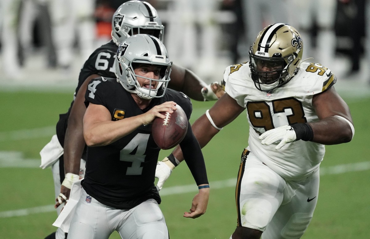 Sep 21, 2020; Raiders quarterback Derek Carr (4) scrambles from New Orleans Saints defensive tackle David Onyemata (93). Mandatory Credit: Kirby Lee-USA TODAY
