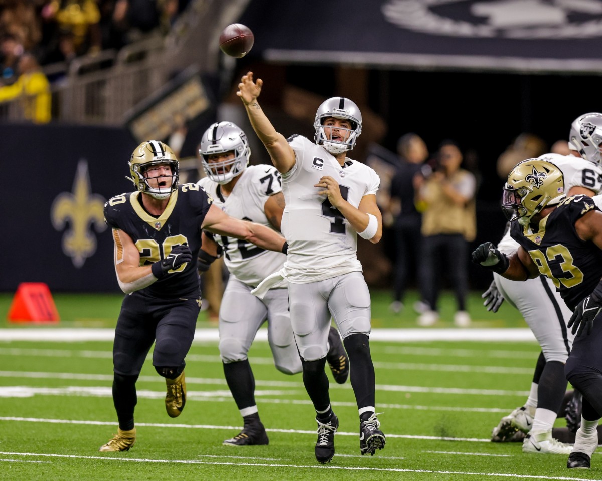 Oct 30, 2022; Raiders quarterback Derek Carr (4) passes downfield against the New Orleans Saints. Mandatory Credit: Stephen Lew-USA TODAY Sports