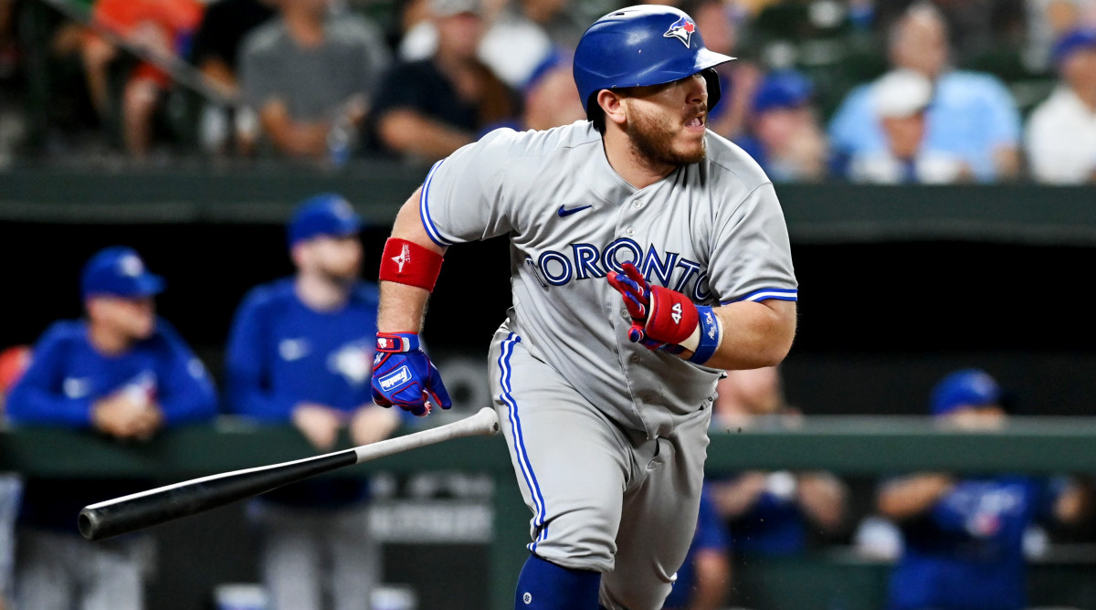 Blue Jays catcher Alejandro Kirk tosses his bat after hitting an RBI single in the sixthh inning.