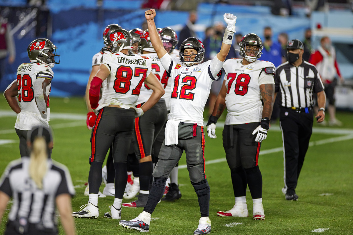 Tom Brady raises his arms in celebration during Super Bowl LV