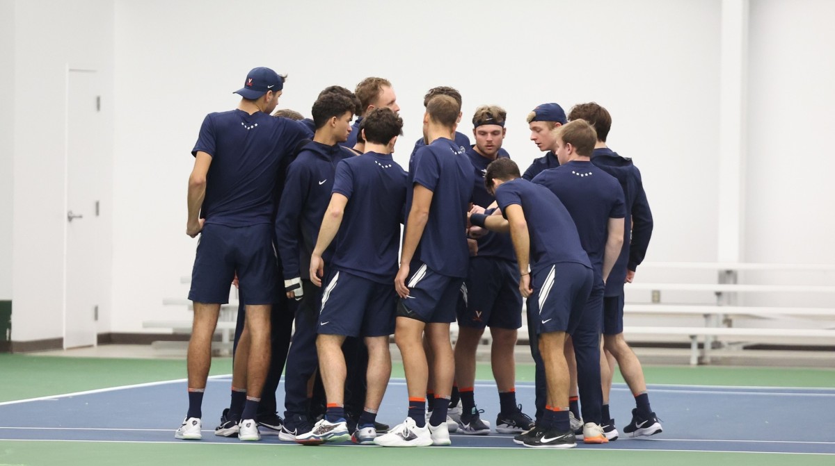 The Virginia men's tennis team huddles before its match against UNC-Wilmington at Boar's Head Sports Club.