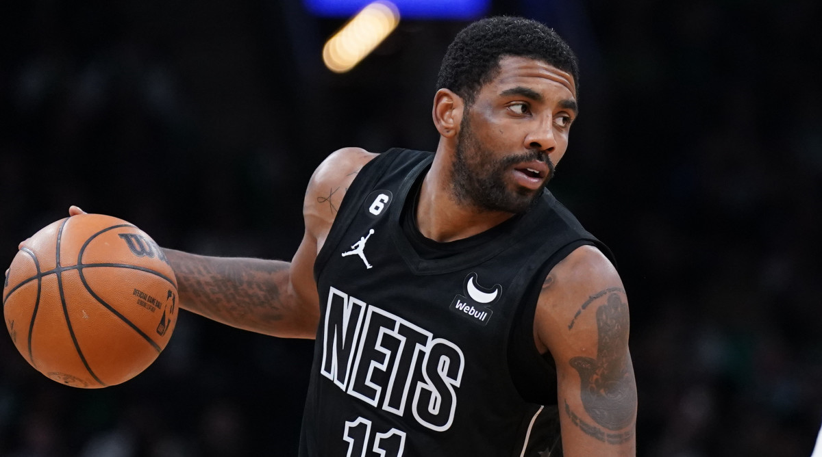 Nets guard Kyrie Irving dribbles the ball