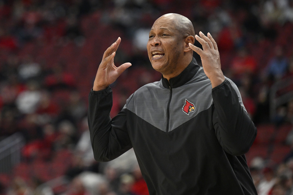 Louisville Cardinals head coach Kenny Payne reacts, throwing his hands up