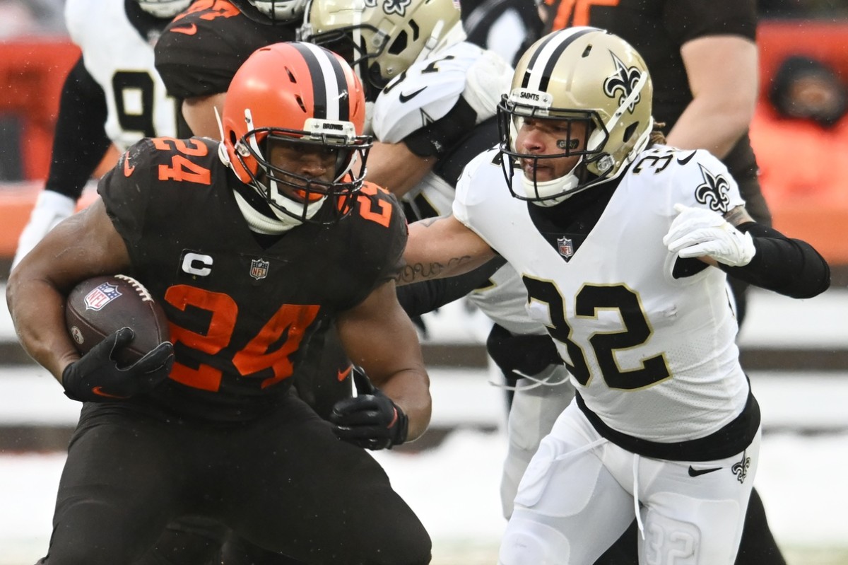 Cleveland Browns running back Nick Chubb (24) runs with the ball as New Orleans Saints safety Tyrann Mathieu (32) defends. Mandatory Credit: Ken Blaze-USA TODAY Sports