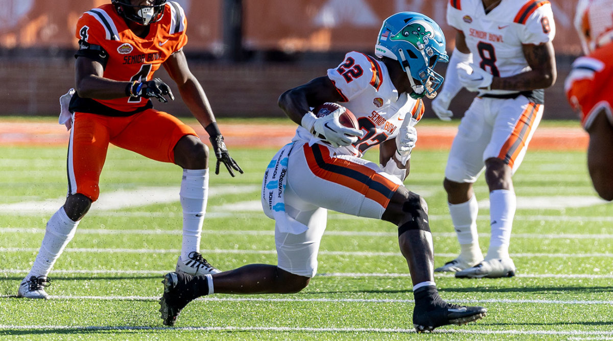Tulane running back Tyjae spears carries the ball at the Senior Bowl