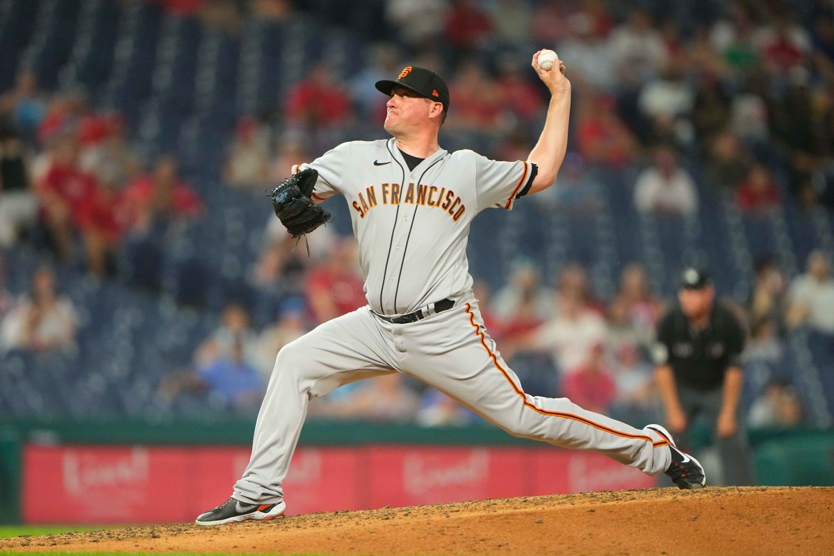 SF Giants pitcher Jake McGee (17) delivers a pitch against the Philadelphia Phillies. (2022)