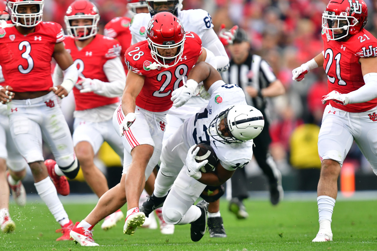 Utah Utes safety Sione Vaki (28) tackles Penn State Nittany Lions running back Kaytron Allen (13) in the first quarter in the 109th Rose Bowl game at the Rose Bowl.