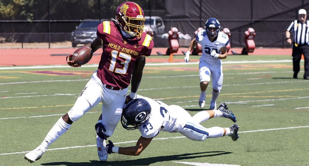 Jurrion Dickey runs after the catch for Menlo Atherton against Bellarmine College Prep.