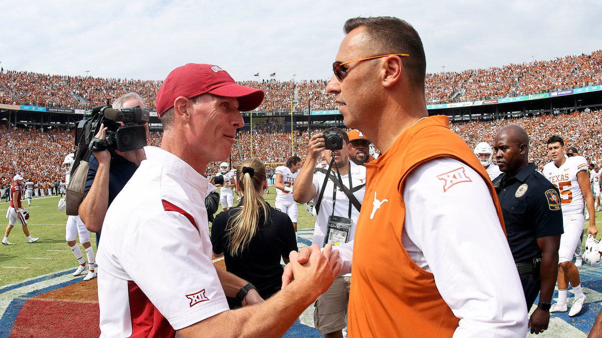 Brent Venables and Steve Sarkisian shake hands after Oklahoma-Texas