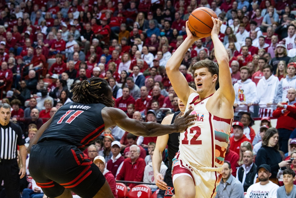 Indiana Hoosiers forward Miller Kopp (12) shoots the ball while Rutgers Scarlet Knights center Clifford Omoruyi (11) defends in the first half at Simon Skjodt Assembly Hall.