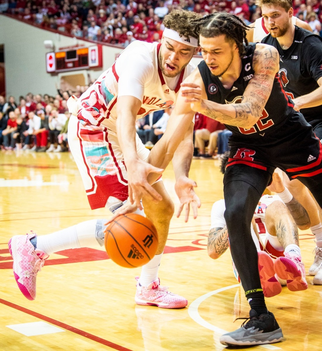 Race Thompson (25) battles with Rutgers Caleb McConnell (22) during the first half of the Indiana versus Rutgers men's basketball game.