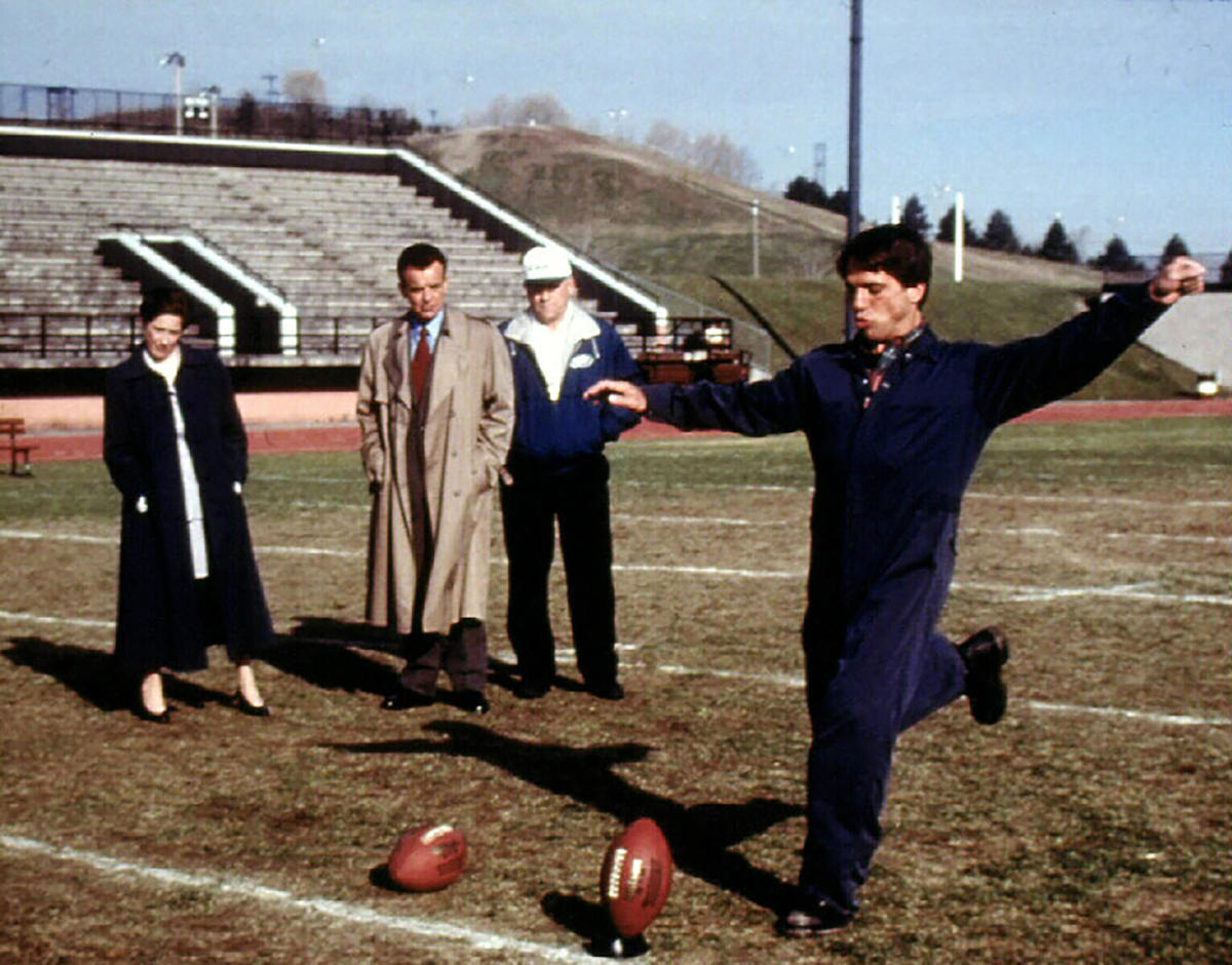 Tony Danza kicks a football during filming of The Garbage Picking Field Goal Kicking Philadelphia Phenomenon