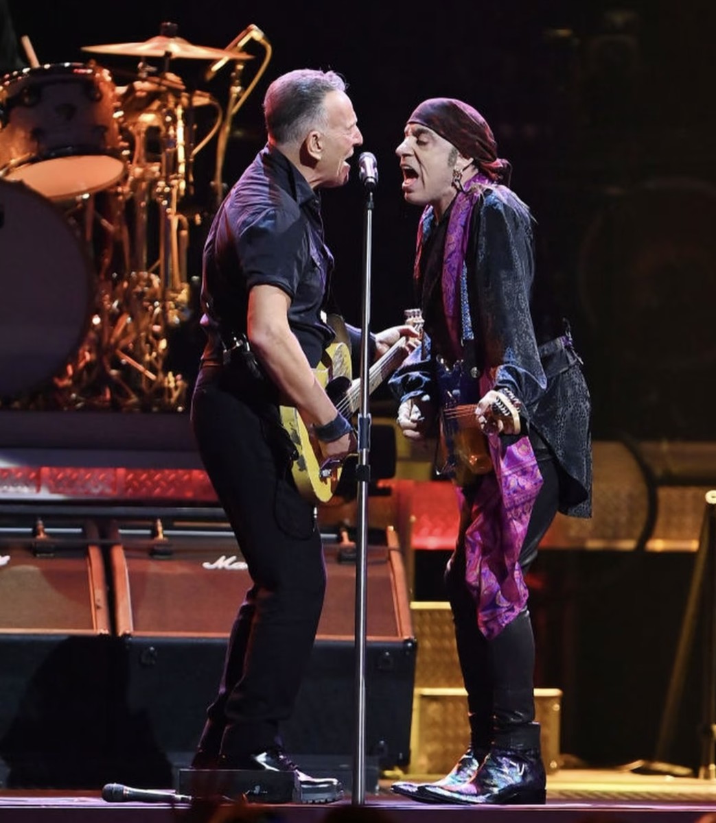 Bruce Springsteen and Steven Van Zandt rock out during a concert in Orlando, Fla. on Sunday.