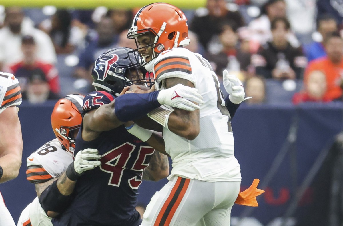 Houston Texans linebacker Ogbonnia Okoronkwo (45) attempts to tackle Cleveland Browns quarterback Deshaun Watson (4) during the third quarter at NRG Stadium.
