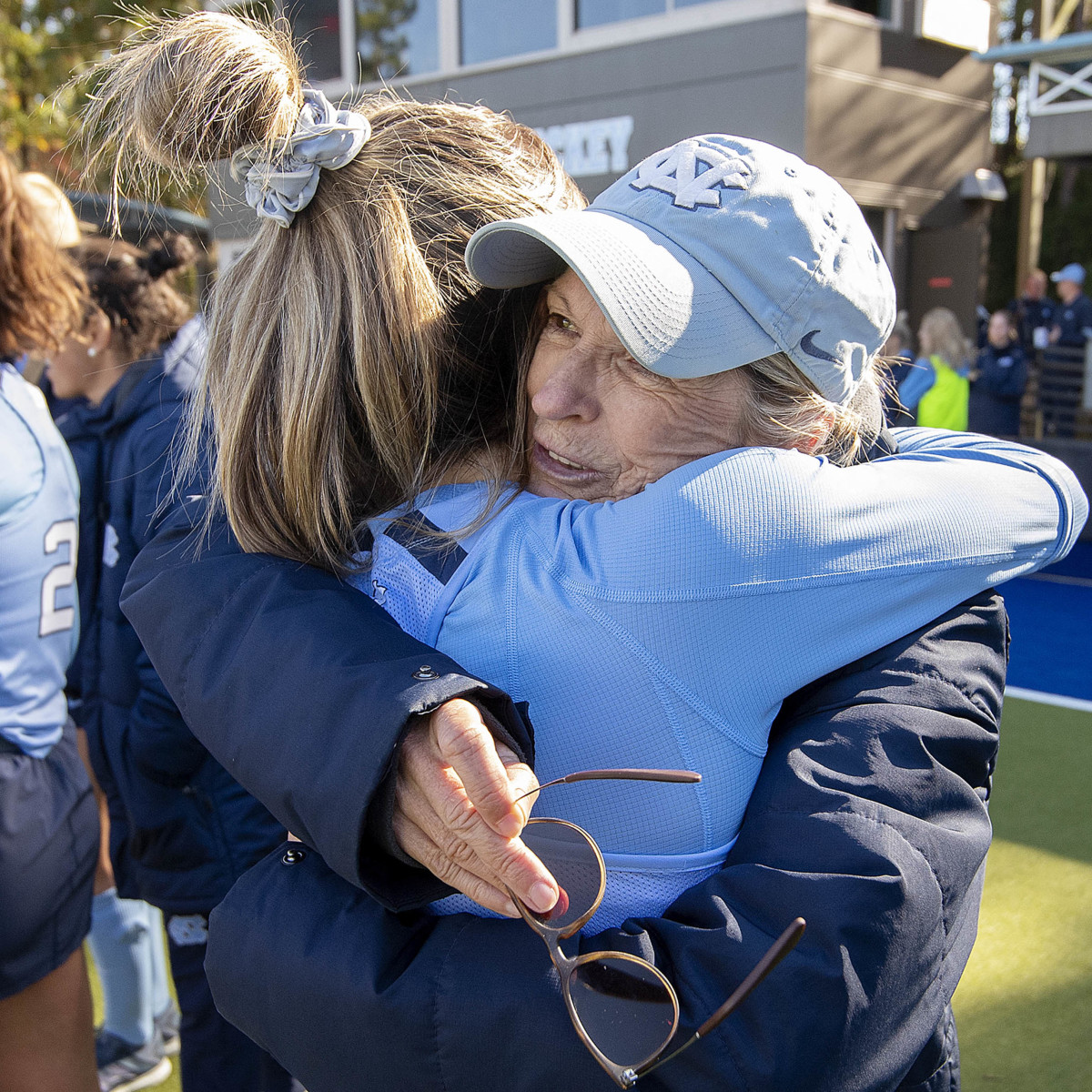 Erin Matson hugs former North Carolina field hockey coach Karen Shelton.