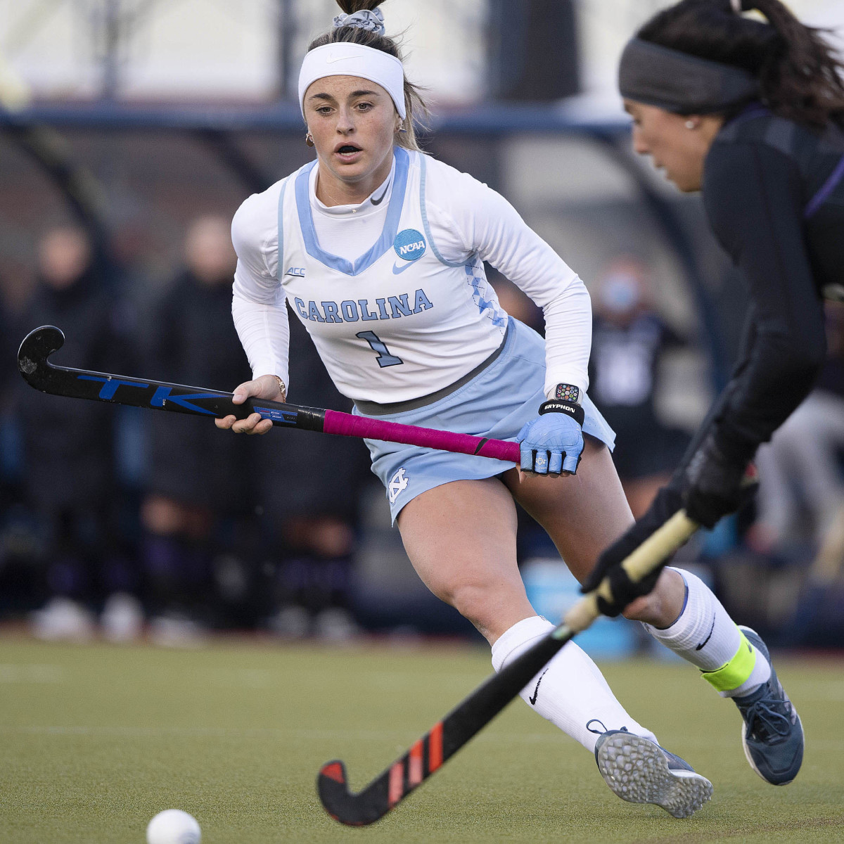 Erin Matson chases after the ball in a North Carolina field hockey game.