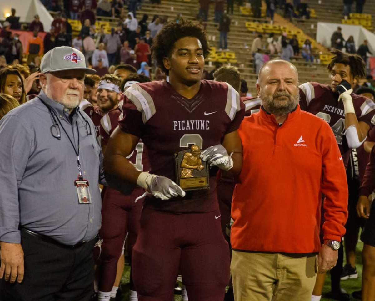 Picayune running back Dante Dowdell (2) poses with the MVP award after winning the MHSAA Class 5A football championship game against West Point. 
