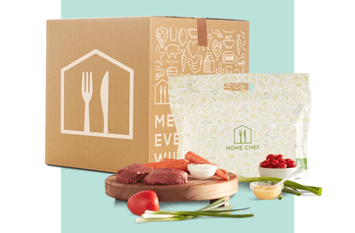 Meal kit ingredients next to Home Chef branded cardboard box