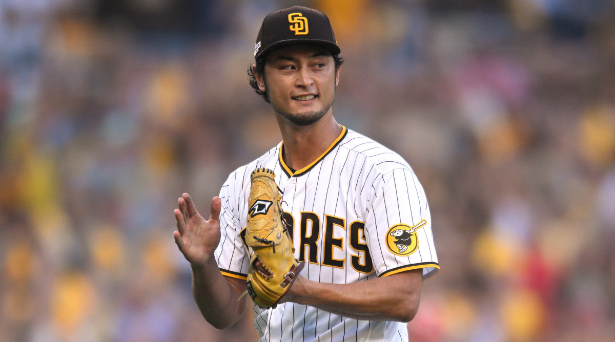 Padres pitcher Yu Darvish applauds an out