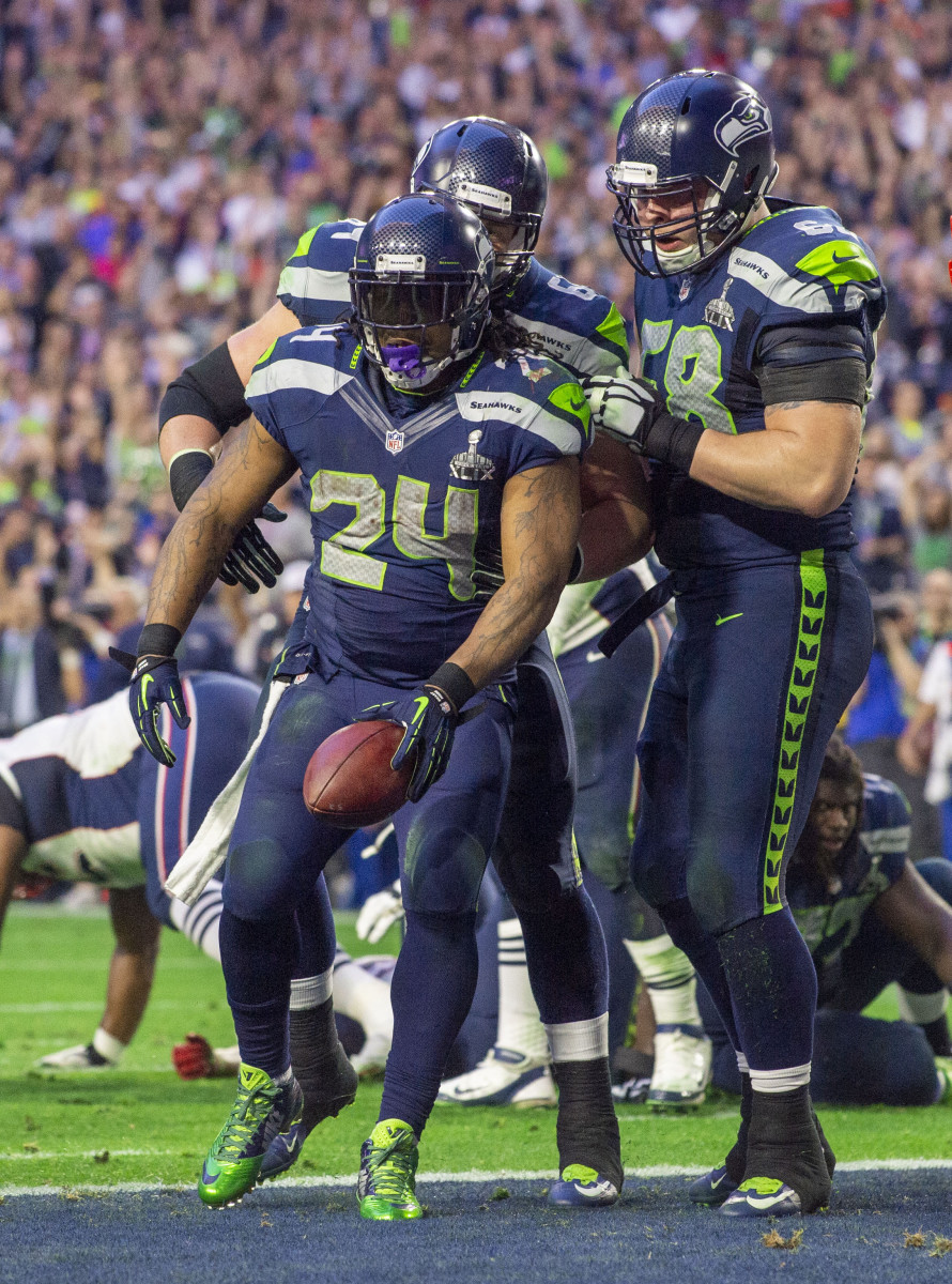 Marshawn Lynch celebrates after scoring a touchdown in the first half of Super Bowl 49