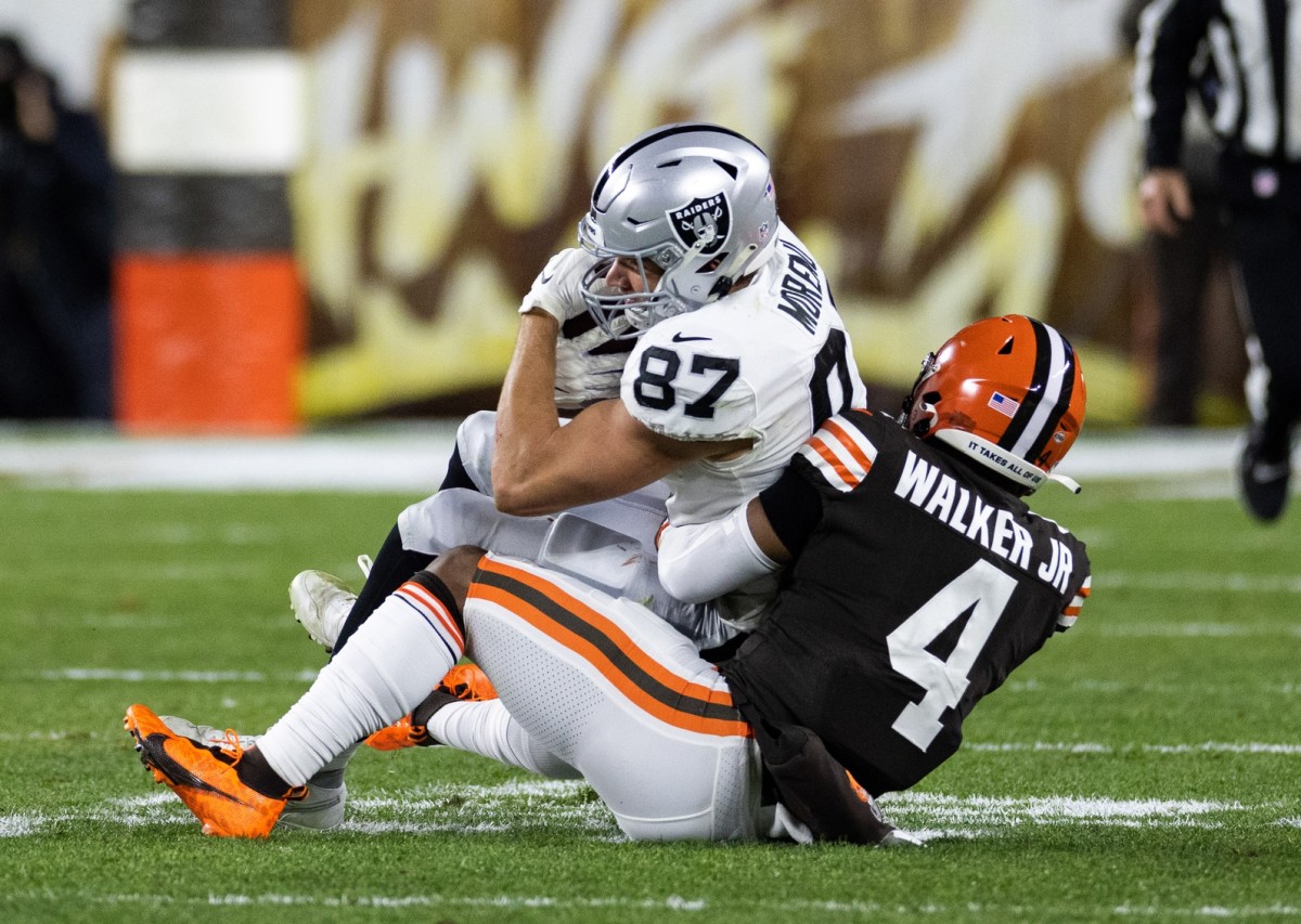 Dec 20, 2021; Cleveland Browns middle linebacker Anthony Walker (4) tackles Las Vegas Raiders tight end Foster Moreau (87). Mandatory Credit: Scott Galvin-USA TODAY Sports