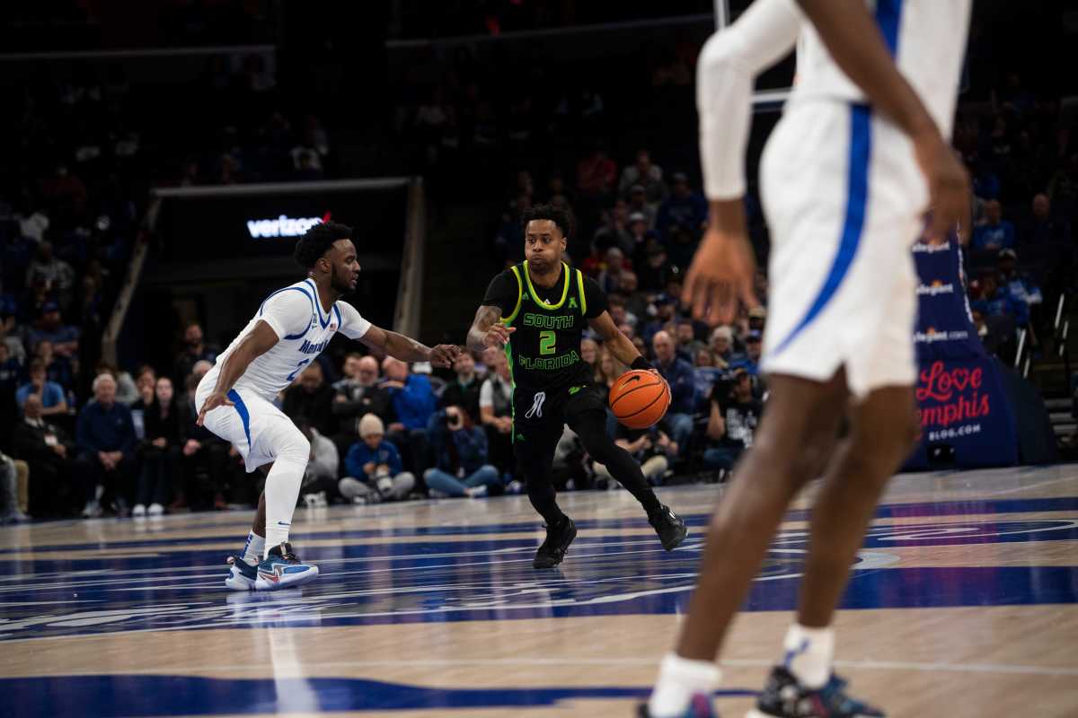 The Memphis Tigers guard Alex Lomax (2) guards South Florida guard Tyler Harris (2) during a game on Dec. 29, 2022 at the Fedex Forum in Memphis. Memphis Tigers vs South Florida Bulls