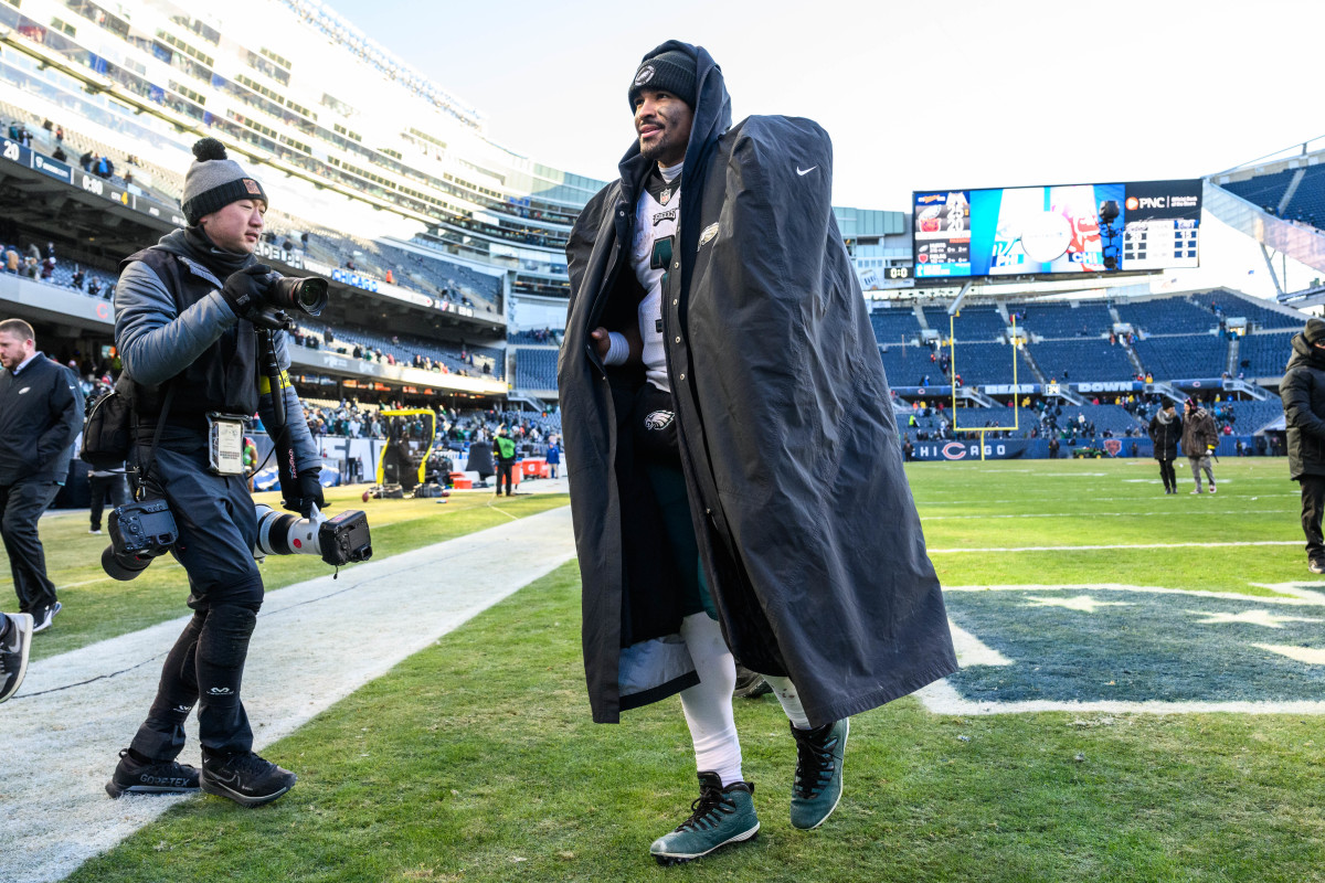 Jalen Hurts walks off the field after the Eagles' victory over the Bears