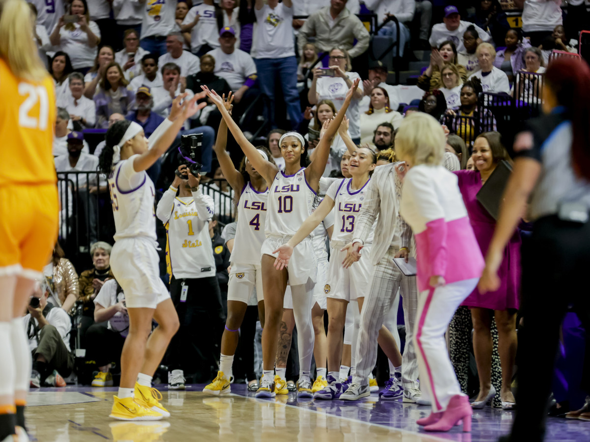 LSU forward Angel Reese celebrates with teammates after a win against Tennessee.