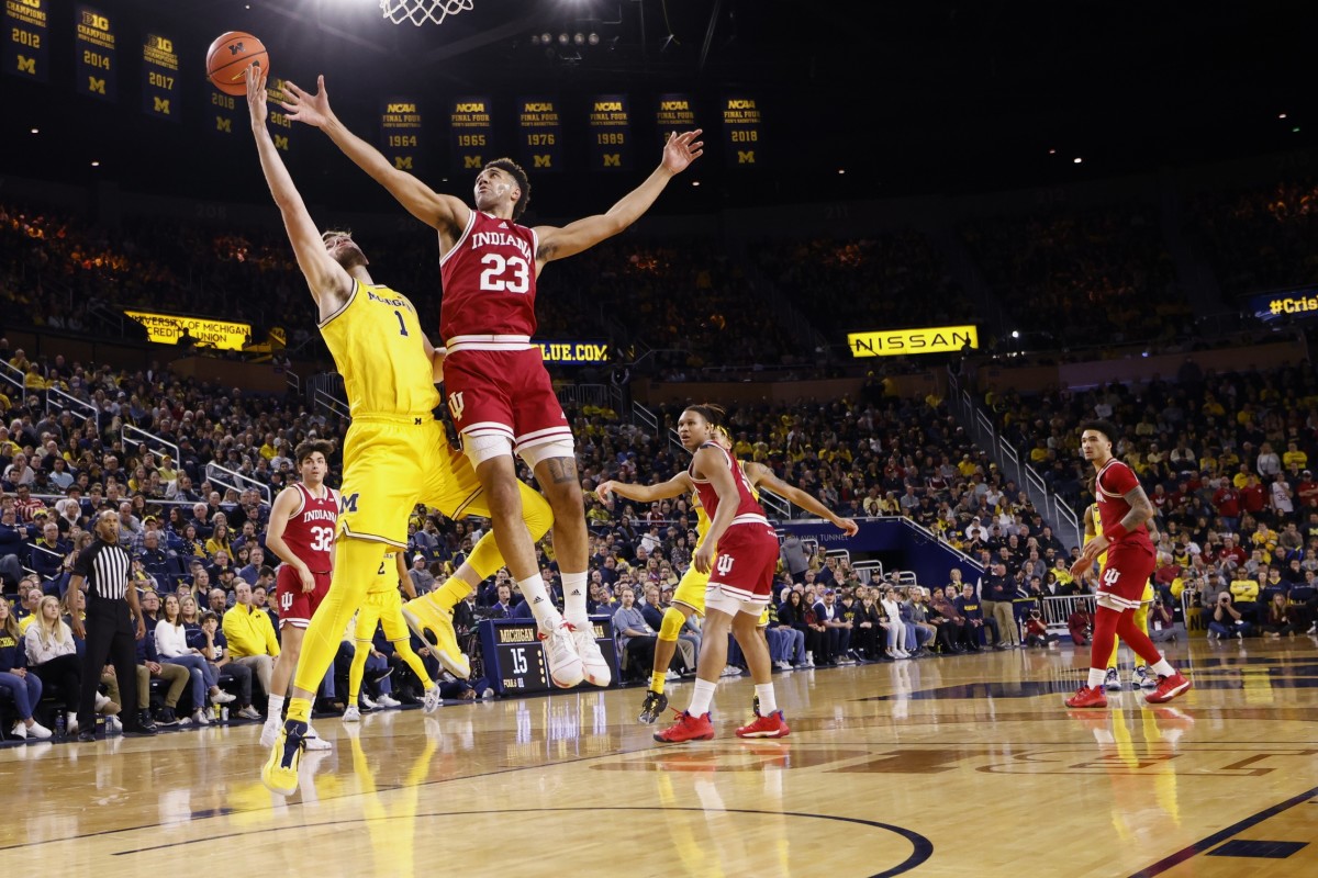 Michigan Wolverines center Hunter Dickinson (1) and Indiana Hoosiers forward Trayce Jackson-Davis (23) battle for the ball.