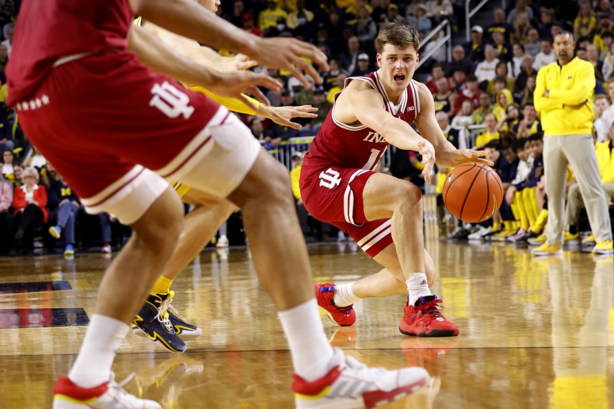 Miller Kopp (12) passes during the second half against the Michigan Wolverines at Crisler Center.