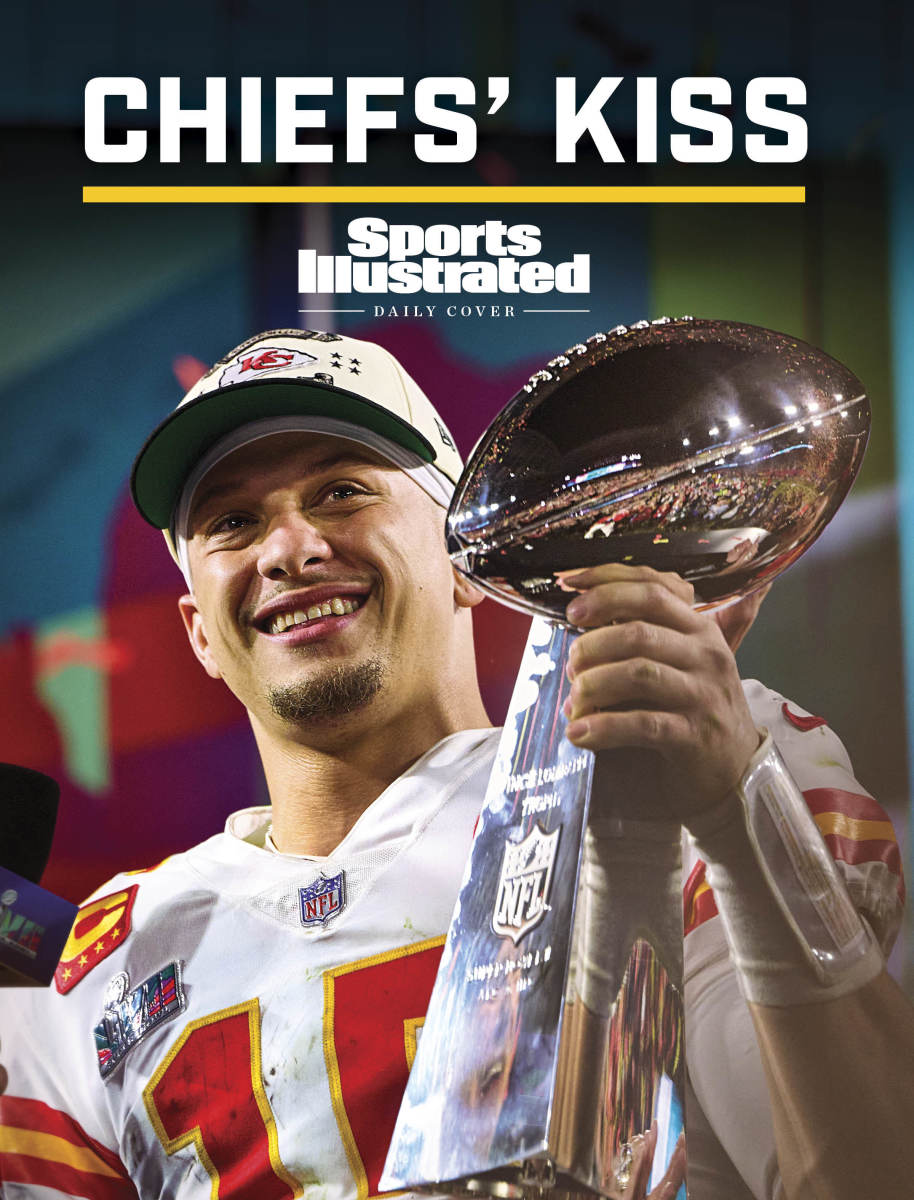 Patrick Mahomes smiles as he holds the Lombardi Trophy