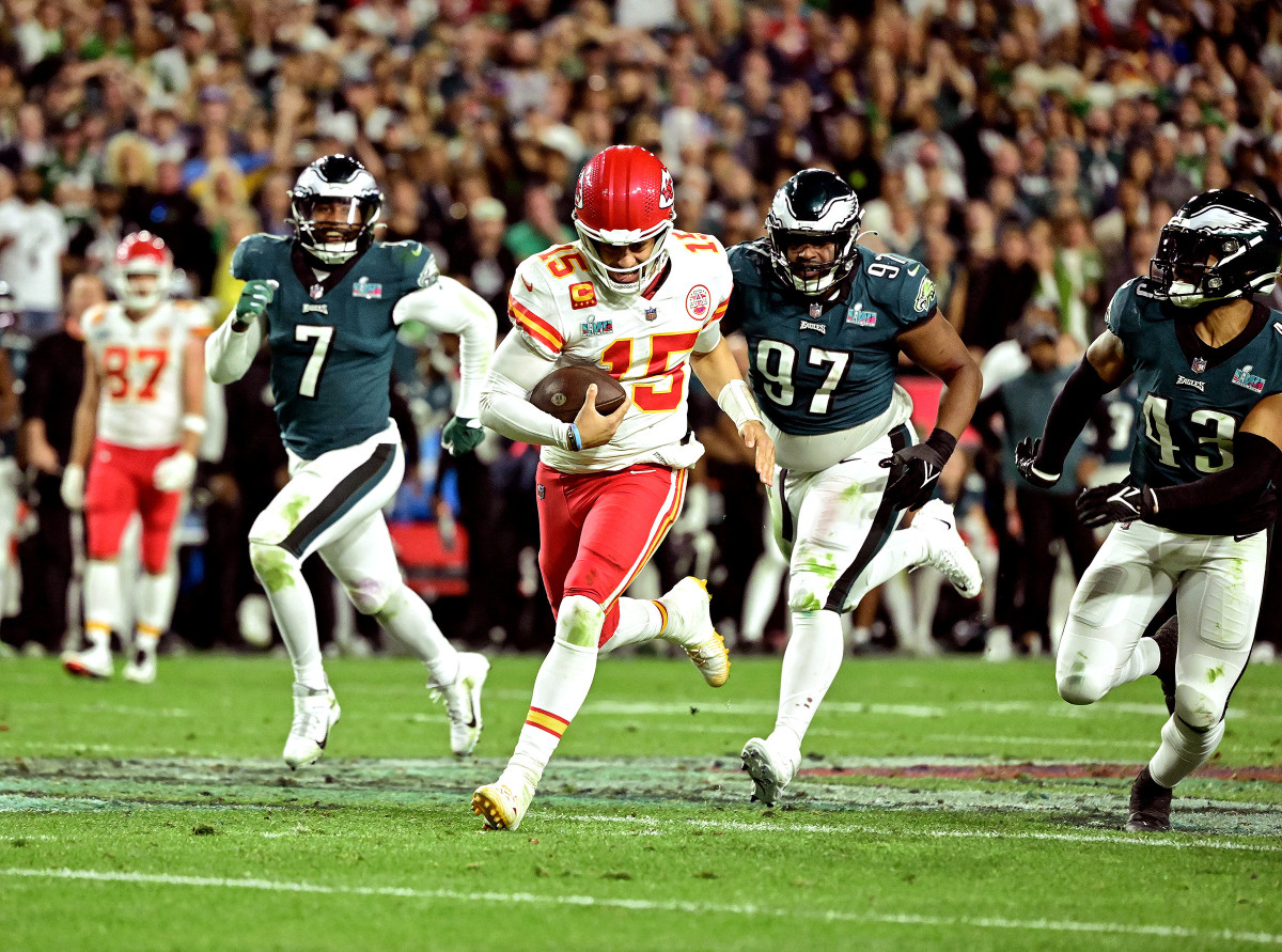 Patrick Mahomes runs for a first down as Eagles defenders give chase in the fourth quarter of Super Bowl LVII