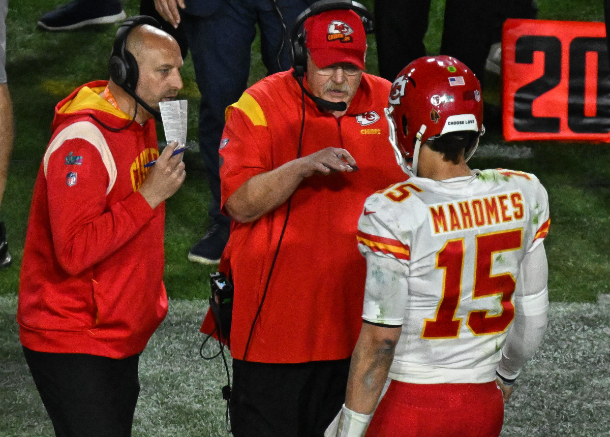 Andy Reid and assistant coach Matt Nagy talk to Patrick Mahomes on the sideline of Super Bowl LVII
