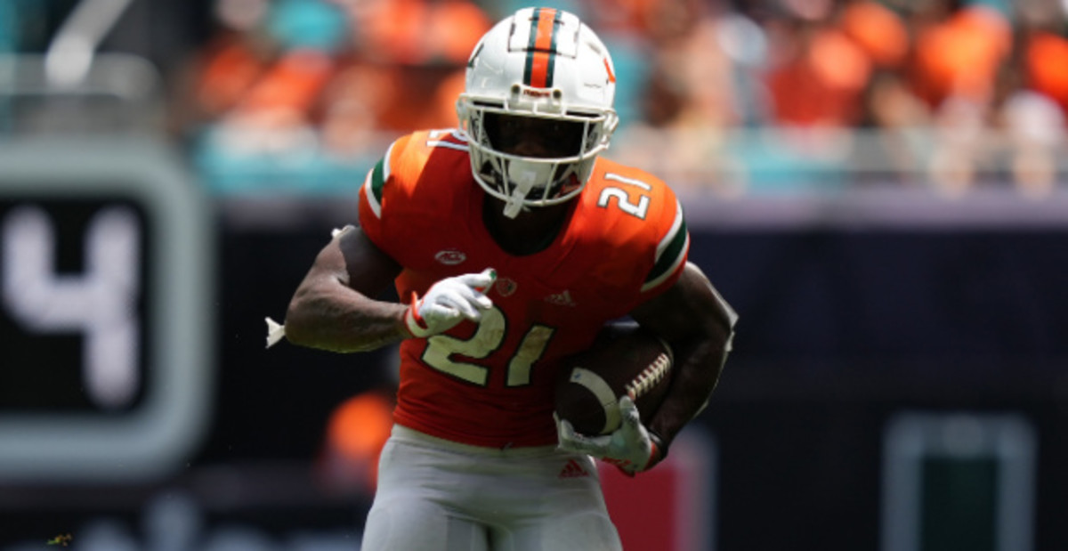 Miami Hurricanes running back Henry Parrish, Jr. on a rushing attempt during a college football game in the ACC.