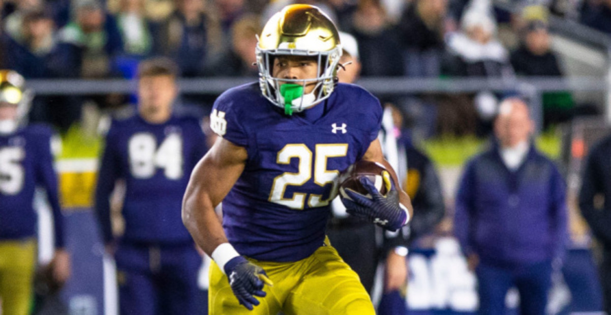 Notre Dame Fighting Irish running back Chris Tyree on a carry during a college football game.