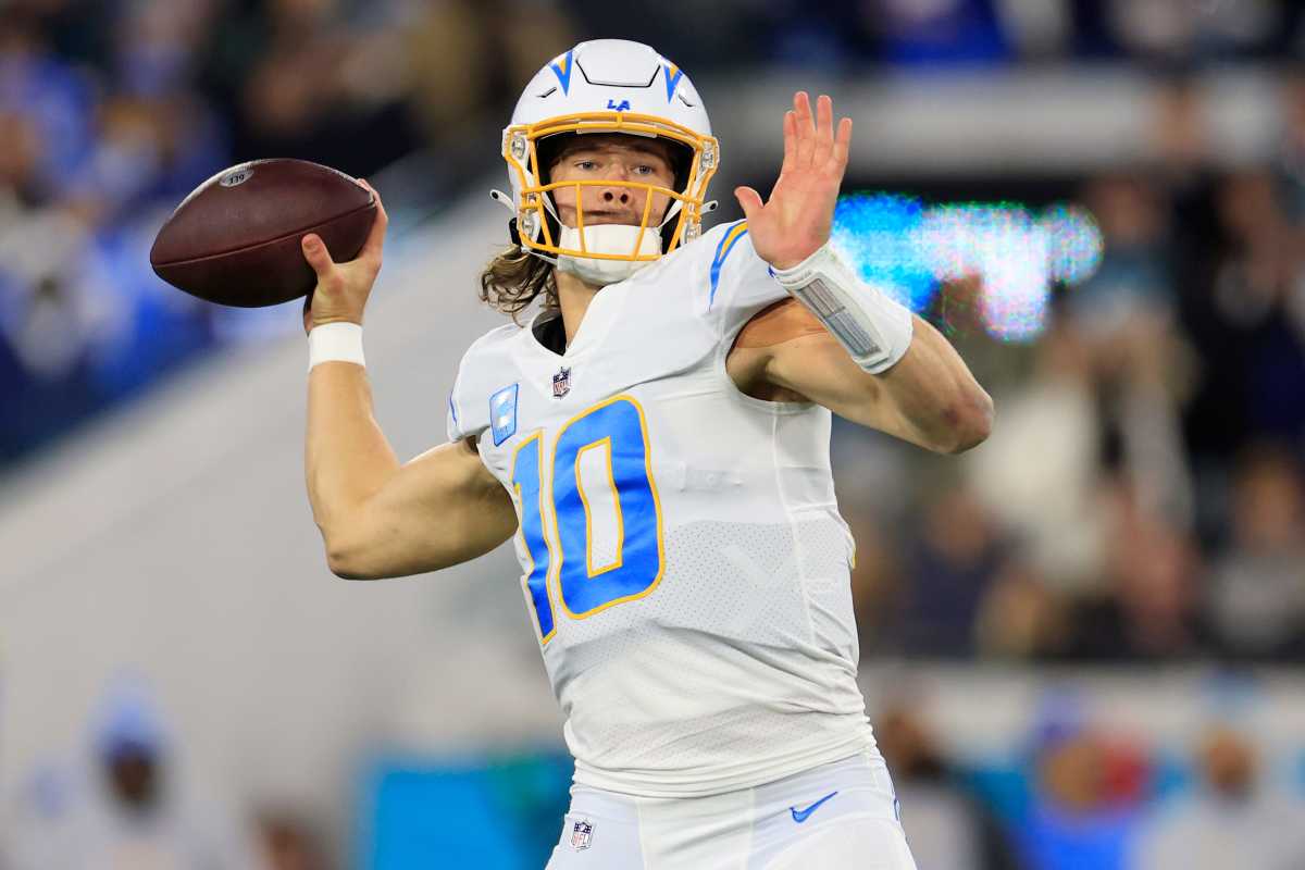 Los Angeles Chargers quarterback Justin Herbert (10) looks to throw during the first quarter of an NFL first round playoff football matchup Saturday, Jan. 14, 2023 at TIAA Bank Field in Jacksonville, Fla. The Jacksonville Jaguars edged the Los Angeles Chargers on a field goal 31-30.