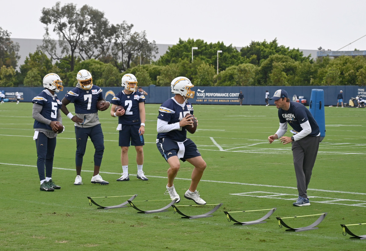 Jun 3, 2019; Costa Mesa, CA, USA; Los Angeles Chargers quarterback Philip Rivers (17) participates in a drill as quarterbacks coach Shane Steichen and quarterbacks Tyrod Taylor (5), Cardale Jones (7) and Easton Stick (2) watch during organized team activities at the Hoag Performance Center.