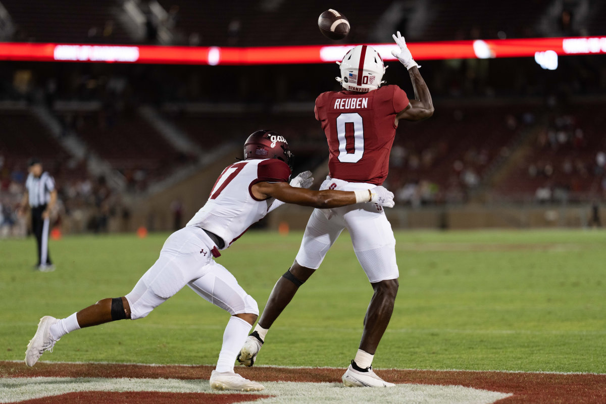Stanford, California, USA; Stanford Cardinal wide receiver Mudia Reuben (0) catches the ball for a touchdown during the fourth quarter against Colgate Raiders defensive back Taitwoine Sanders (17) at Stanford Stadium.