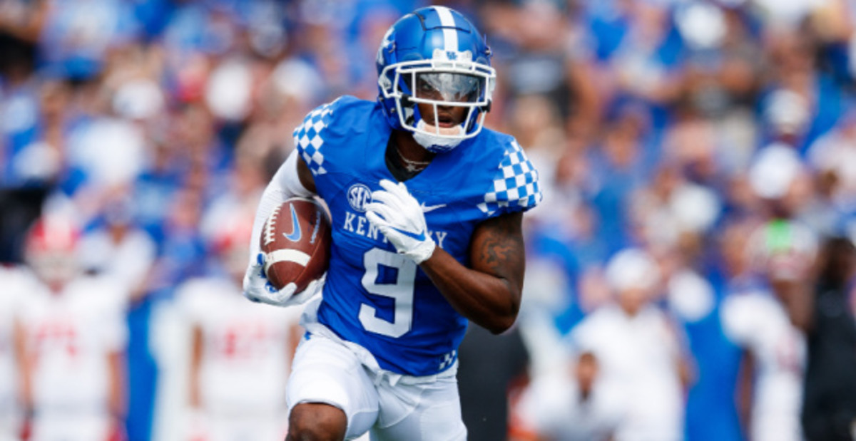 Kentucky Wildcats wide receiver Tayvion Robinson catches a pass during a college football game in the SEC.